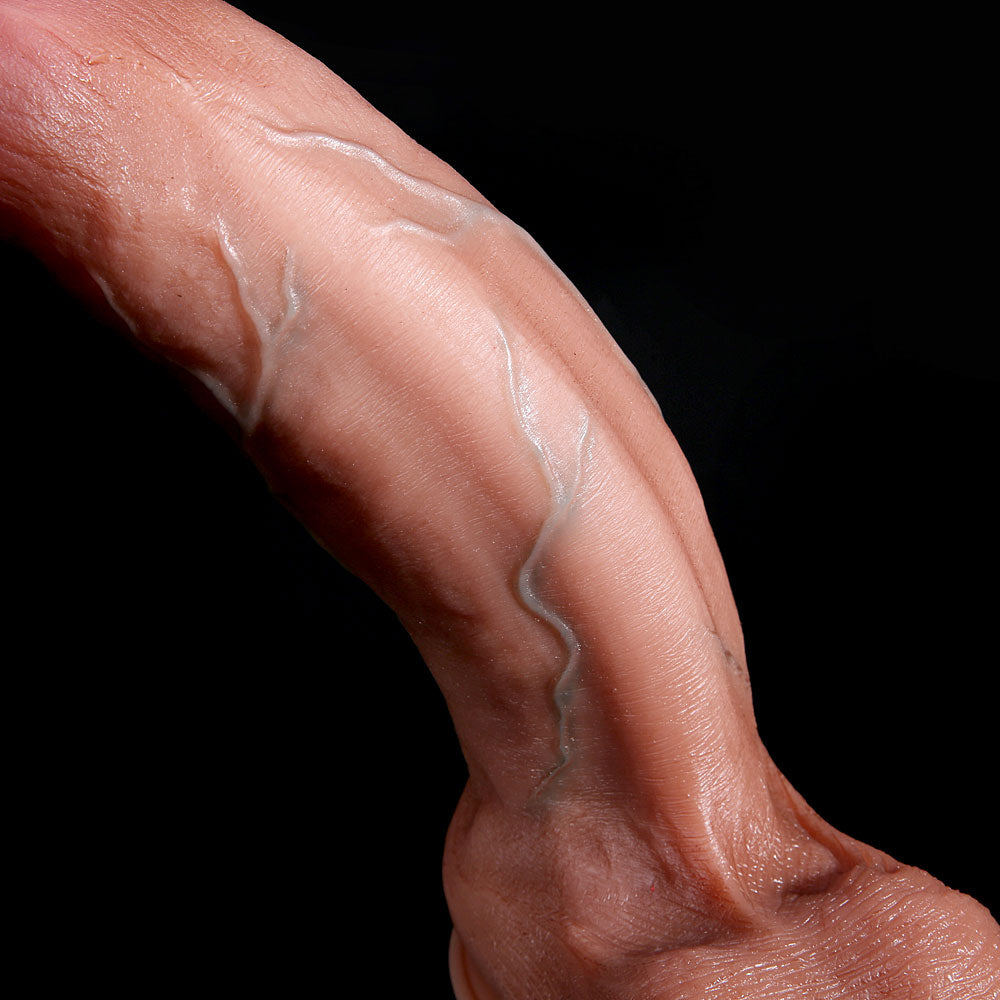 flexible giant dildo bent by hand to demonstrate soft outer layer and firm core design