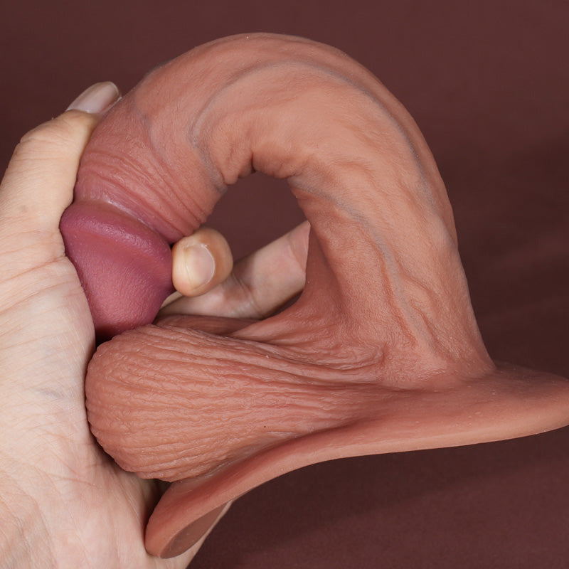 hand bending flexible silicone dildo to demonstrate soft feel and responsive curved design