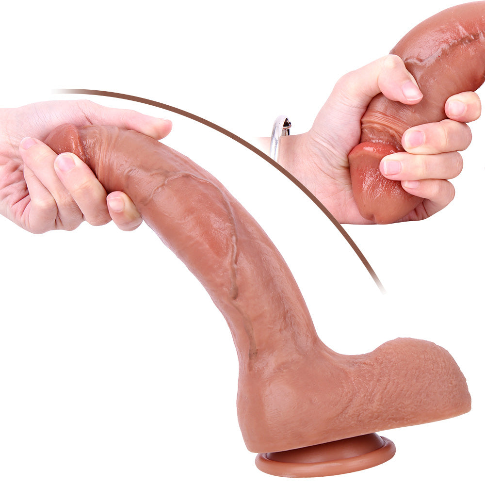 Hand gripping the dildo tip, highlighting its softness and sculpted coronal ridge.