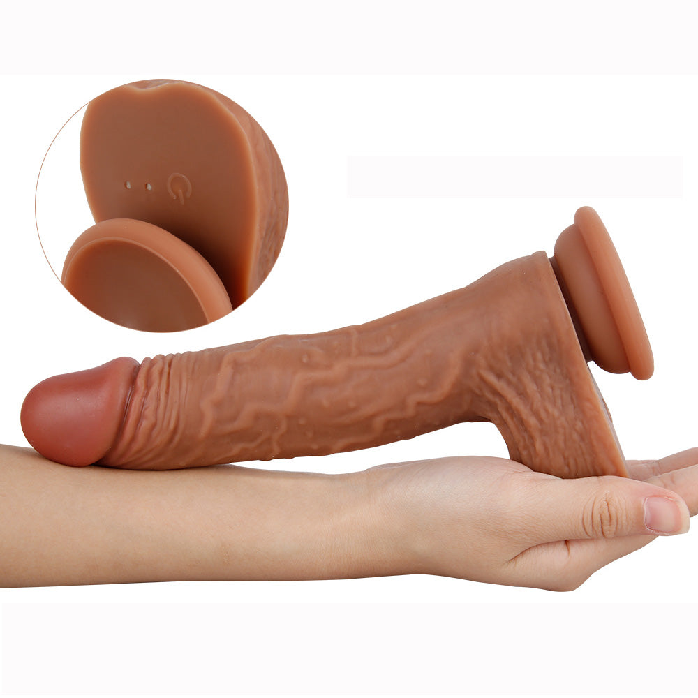 dildo resting on forearm to demonstrate scale and skin texture realism