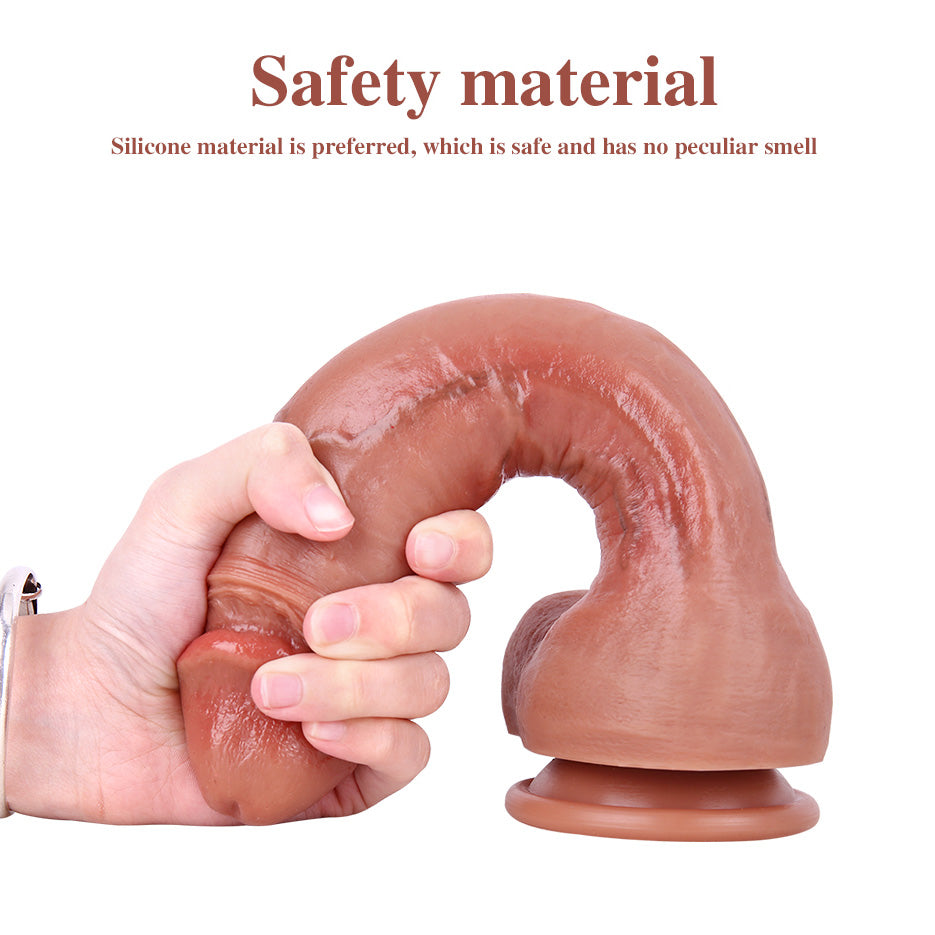 Hand bending the shaft of the MD133 dildo to show flexibility and inner firmness of silicone core.